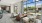  A modern living room with a view of the outdoors through large windows.