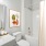  A bathroom with a toilet, sink, and shower.