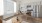  A modern kitchen with a dining table and chairs.